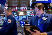 Chứng khoán Mỹ phản ứng thận trọng sau cuộc họp Fed